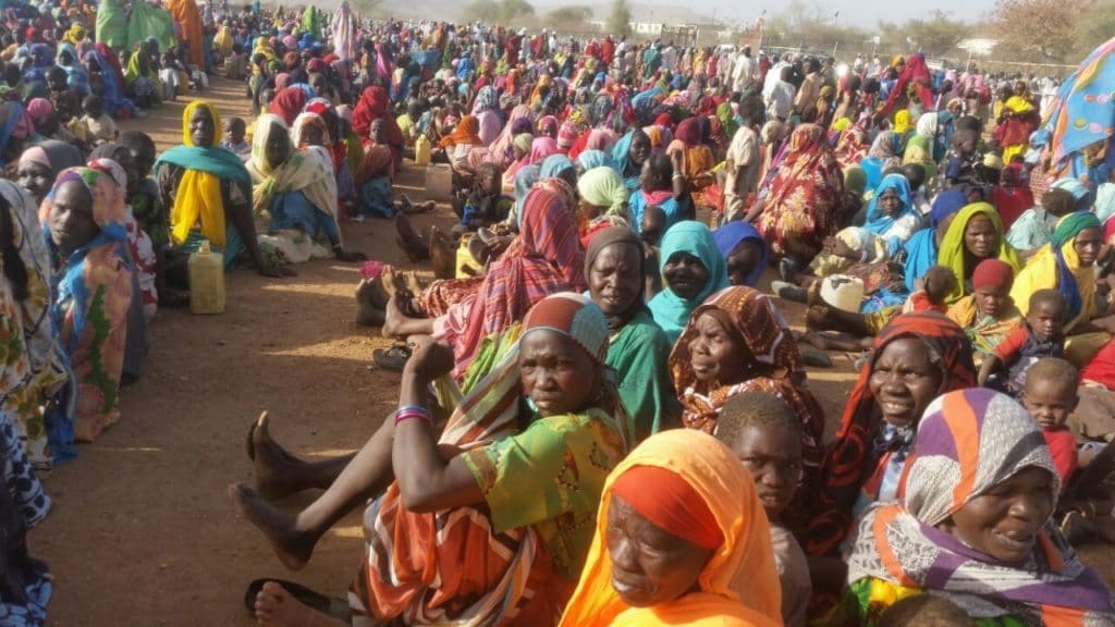 PEOPLE DISPLACED BY VIOLENCE IN NORTHERN JEBEL MARRA IN JANUARY AND FEBRUARY 2016, GATHER AROUND THE UNAMID BASE IN SORTONI, DARFUR.
