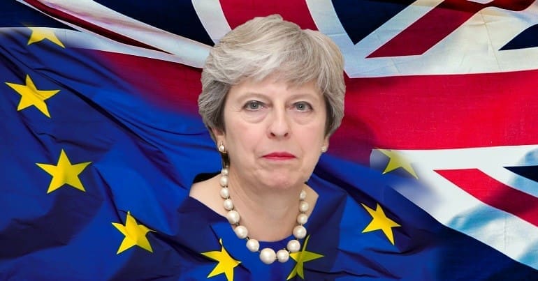 Theresa May superimposed over the UK and EU flags