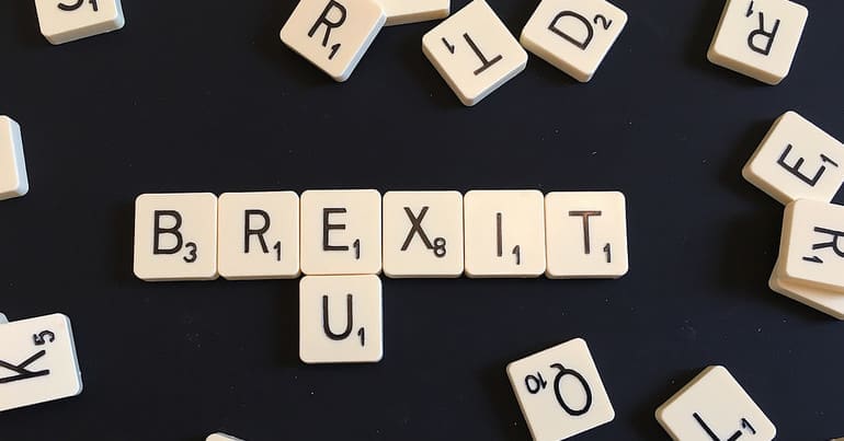 Scrabble letters spelling out Brexit and EU. Brexit poems