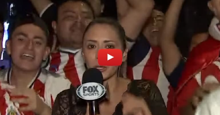 Mexican reporter Maria Fernanda Mora in front of football fans