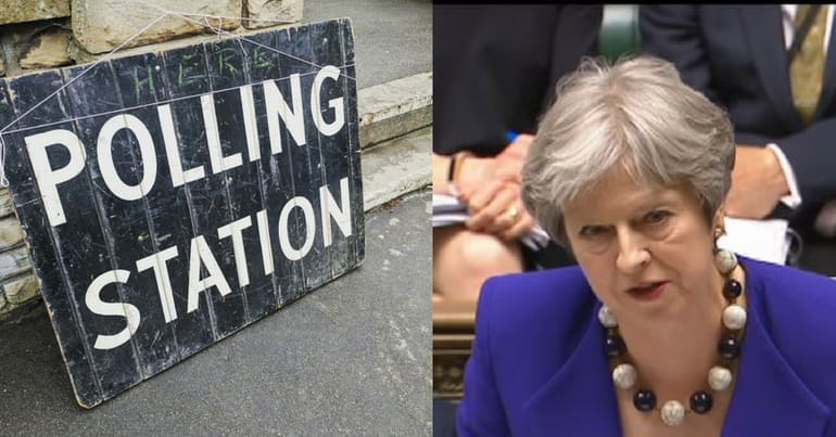A sign outside a polling station, and Theresa May