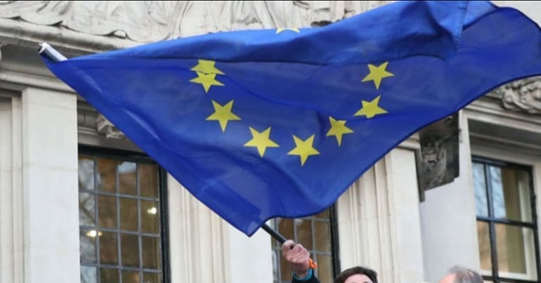 EU flag waving outside UK supreme court