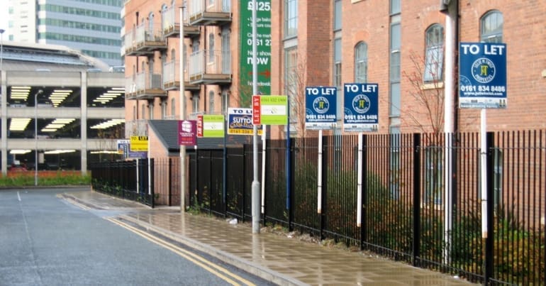 Row of houses with to let signs