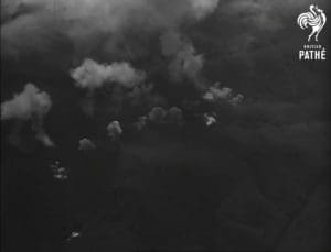 War School - UK bombs dropped by British planes explode in forests in Malaya