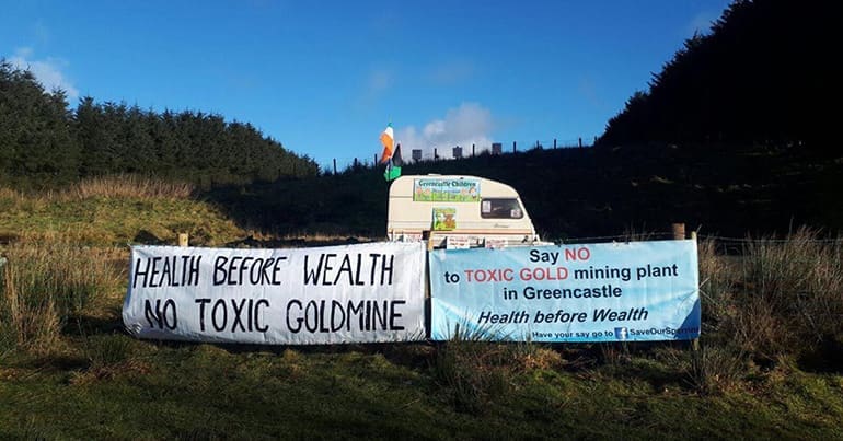 Caravan with protest banners against toxic mine in Co. Tyrone countryside