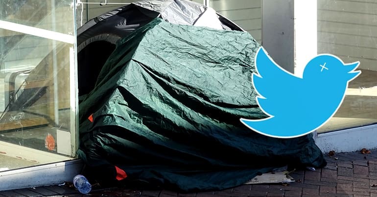 Tent in a shop doorway and 'dead' Twitter logo
