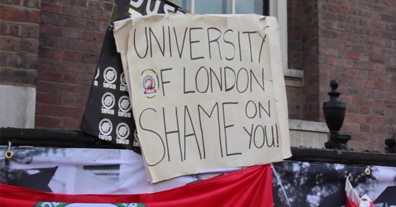 Placard saying "University of London shame on you"