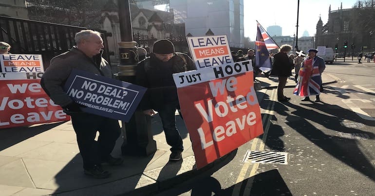 Protestors in favour of a hard Brexit with signs saying "No Deal? No Problem".