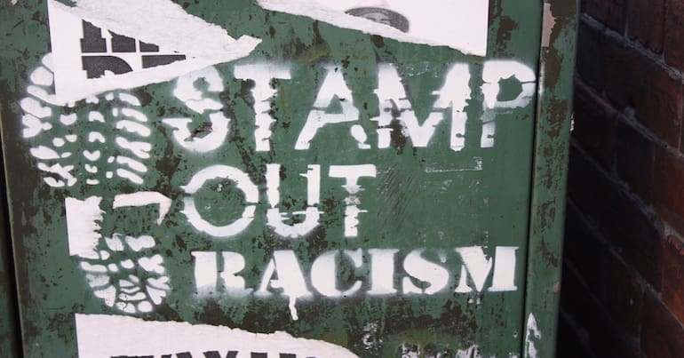 Graffiti of a the Stamp Out Racism slogan and book