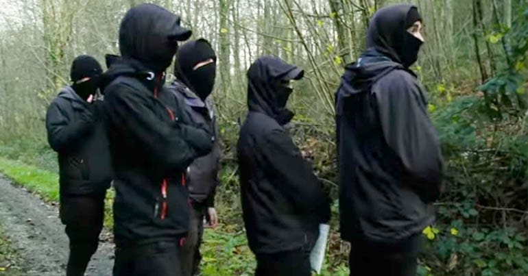 A group of hunt saboteurs wearing masks
