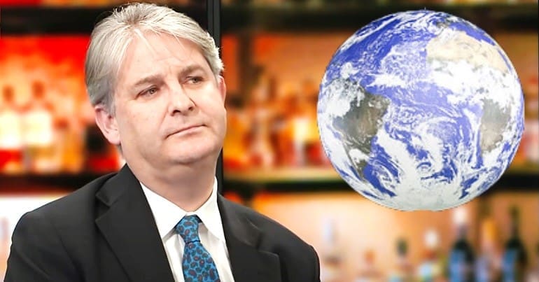 Philip Davies and the earth at COP26