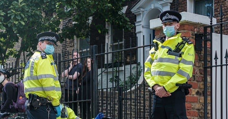 Met police officers looking at the camera
