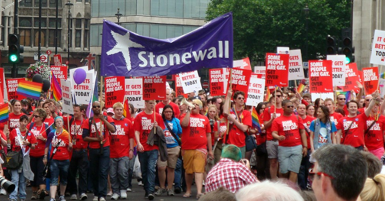 Stonewall banner at Pride in reference to the EHRC letter and GANHRI