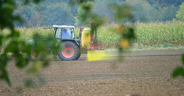 A tractor spraying pesticides PAN UK