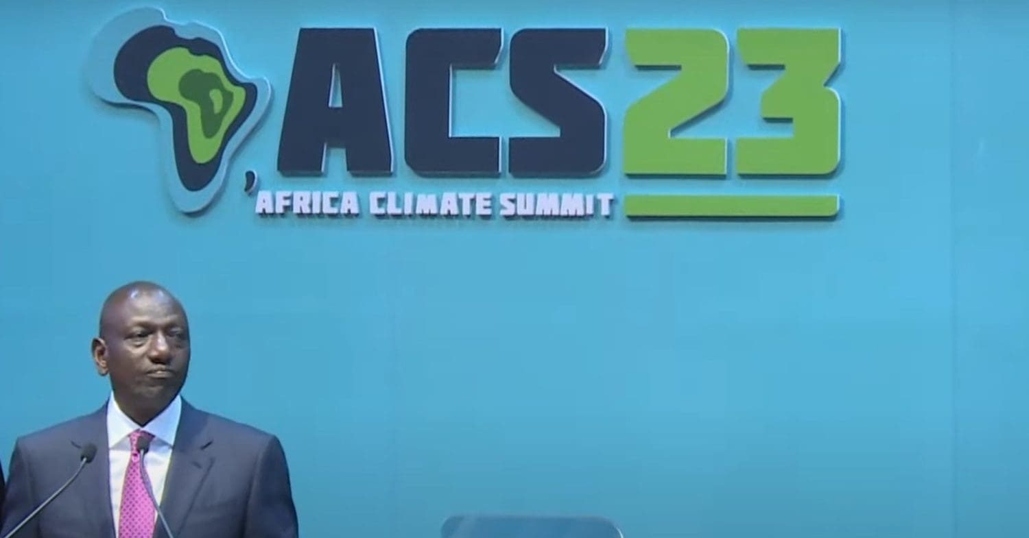 President of Kenya William Ruto stands on stage at the Africa Climate Summit.