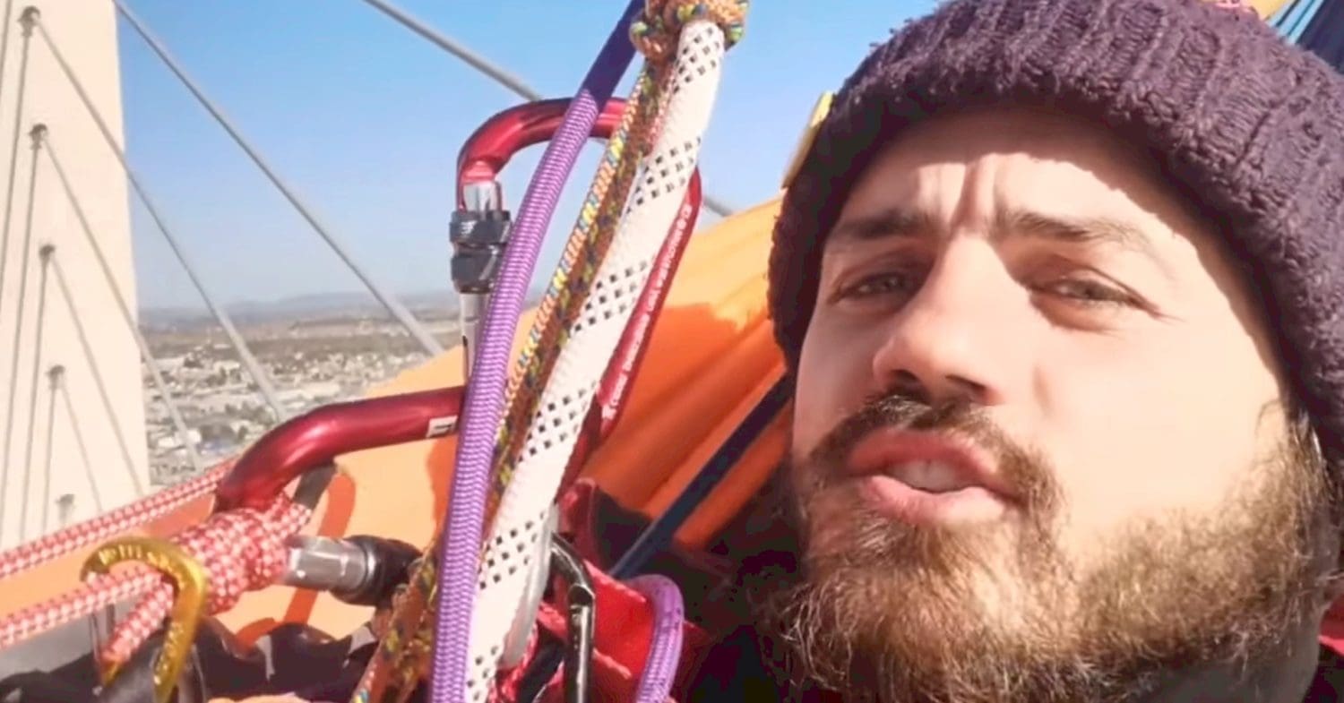 Close-up of Marcus Decker on top of Dartford Crossing during a Just Stop Oil protest