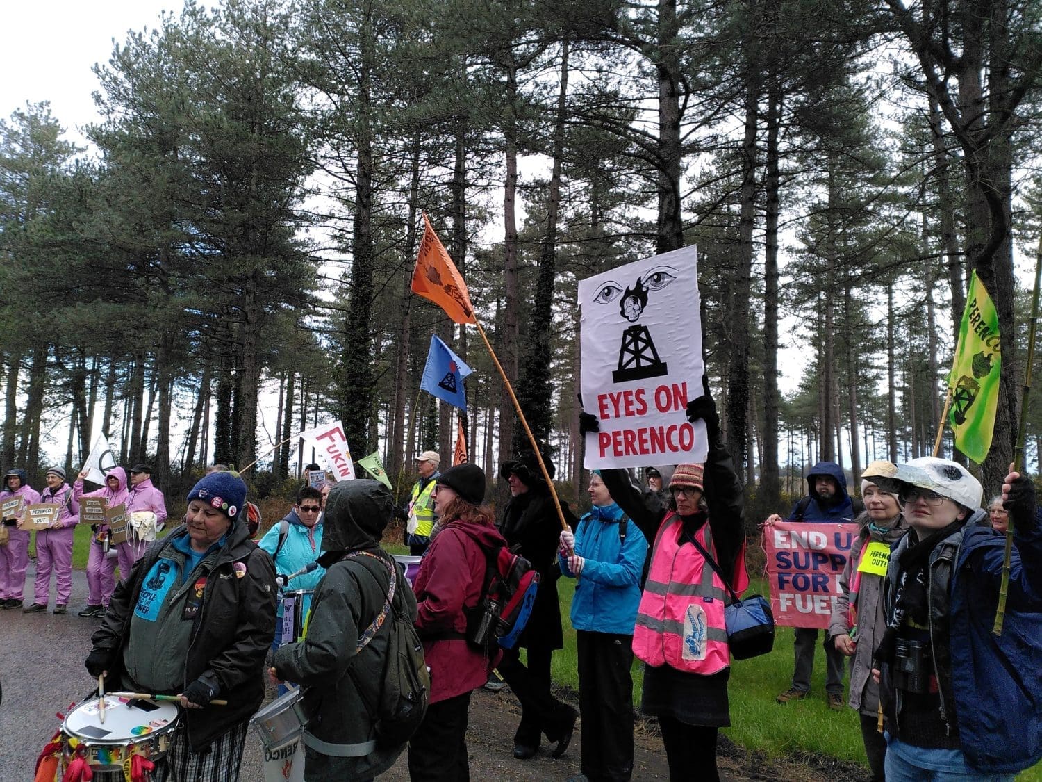 Protesters gather with placards and drums at Wytch Farm.