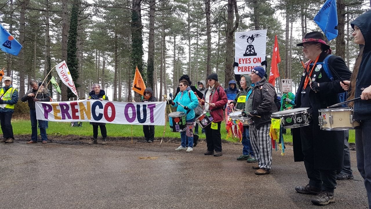 Protesters drum and picnic outside Wytch Farm.