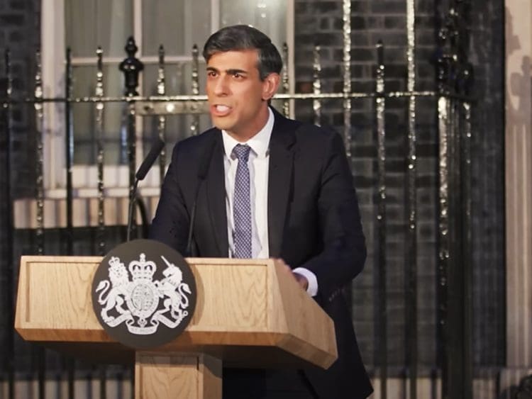 Rishi Sunak looking angry standing at a podium outside 10 Downing street UNCRPD
