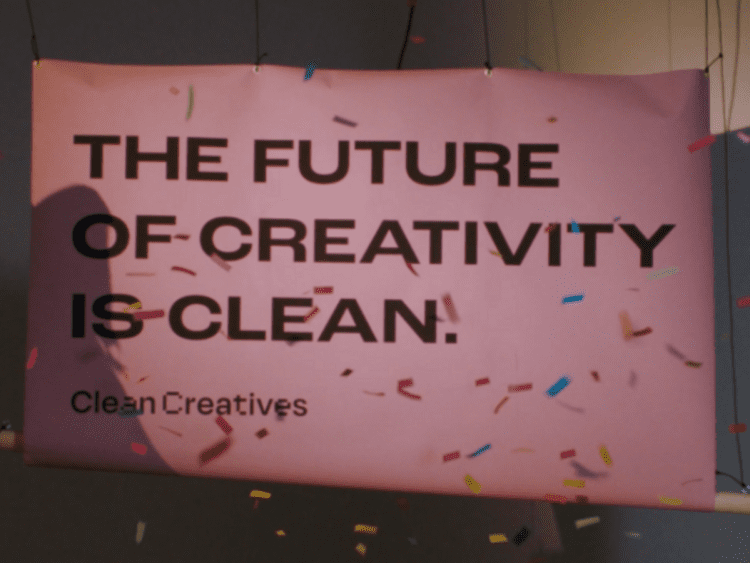 Banner that reads: "The future of creativity is clean" with confetti falling all around it. ad agencies fossil fuels