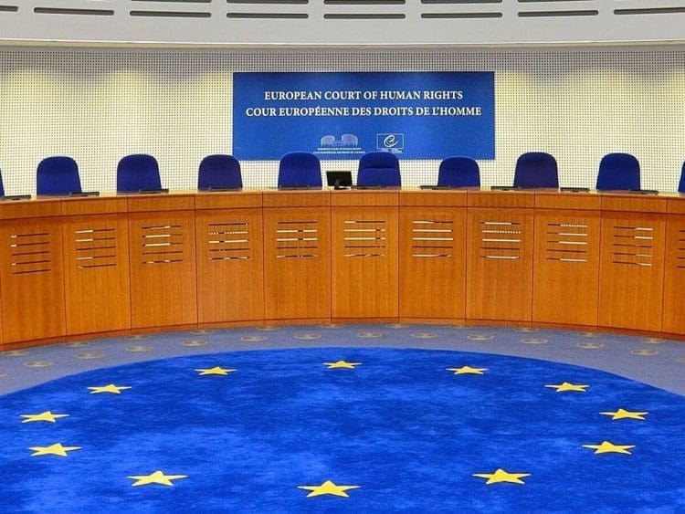 European Court of Human Rights (ECHR) court room, with empty chairs.
