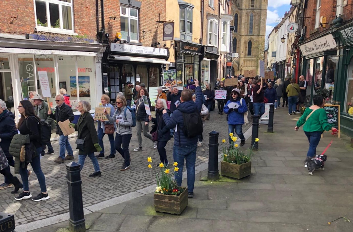 Save the Trees campaigners march through the city centre.