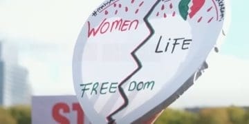 Heart-shaped placard reads: "Women Life Freedom". Iran's executions Iran