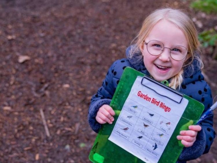 A child playing garden bird bingo Climate Action Countdown schools