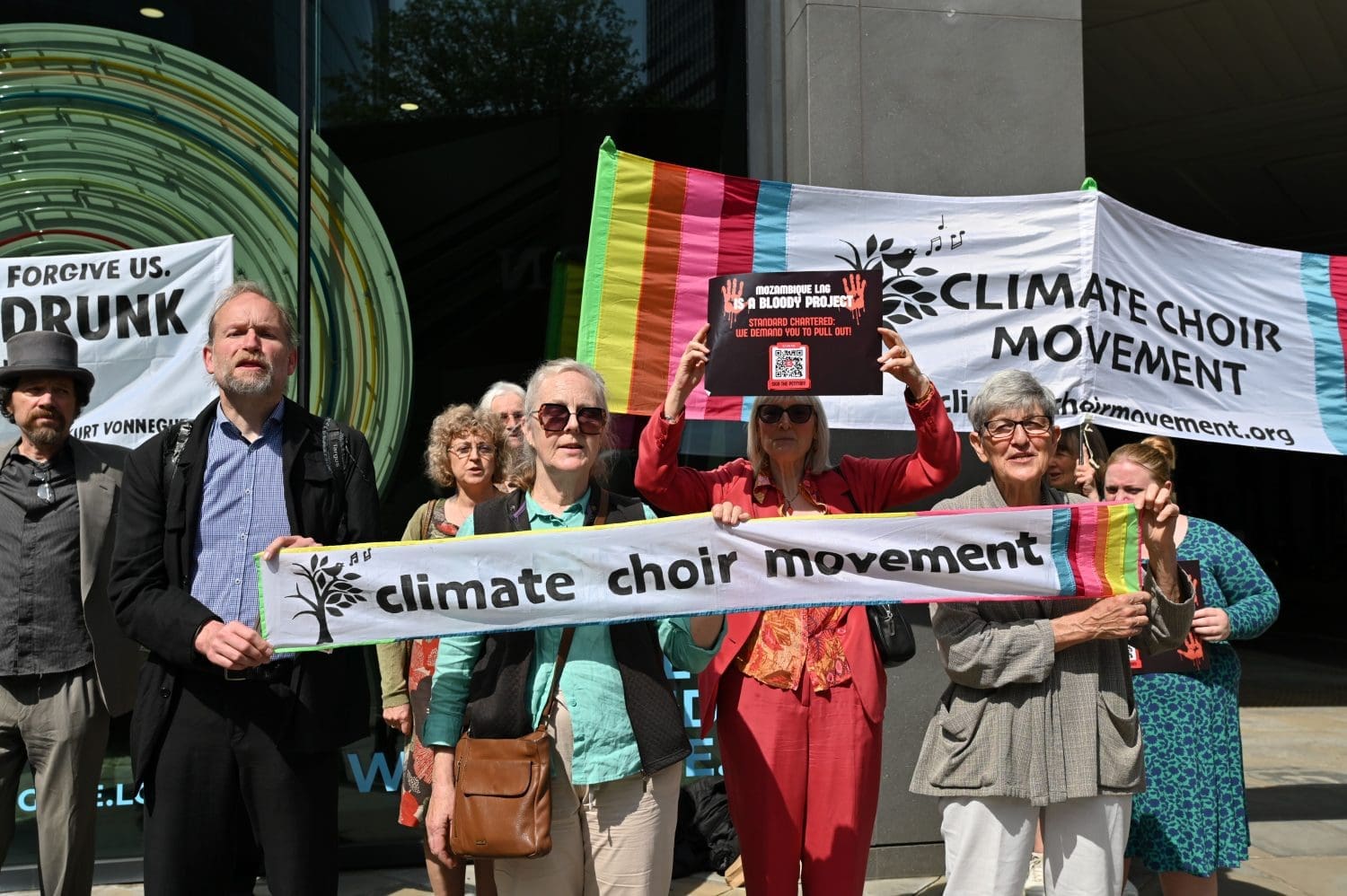 Protesters with Climate Choir Movement banners.