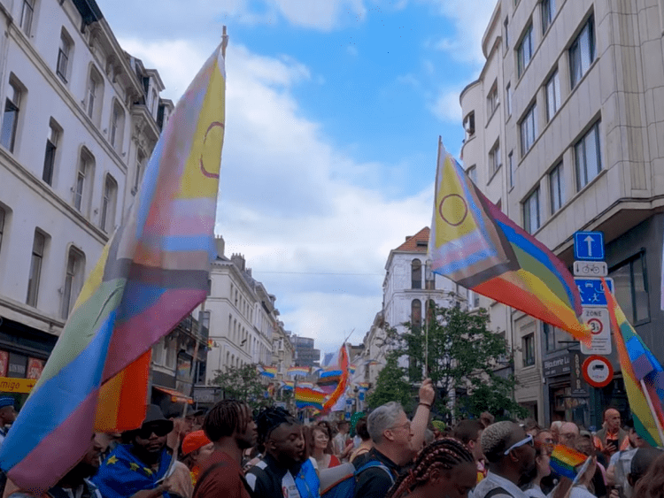 Brussels Pride parade march down the streets with multiple flags Europe LGBTQ+ report