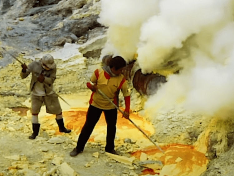 Workers extracting critical minerals in dangerous, toxic conditions without protection.
