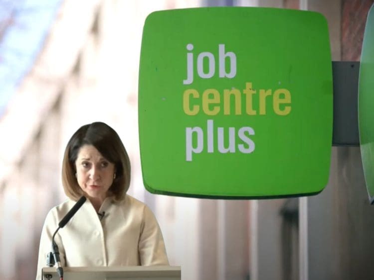 Liz Kendall with a job centre plus sign behind her DWP PIP benefits