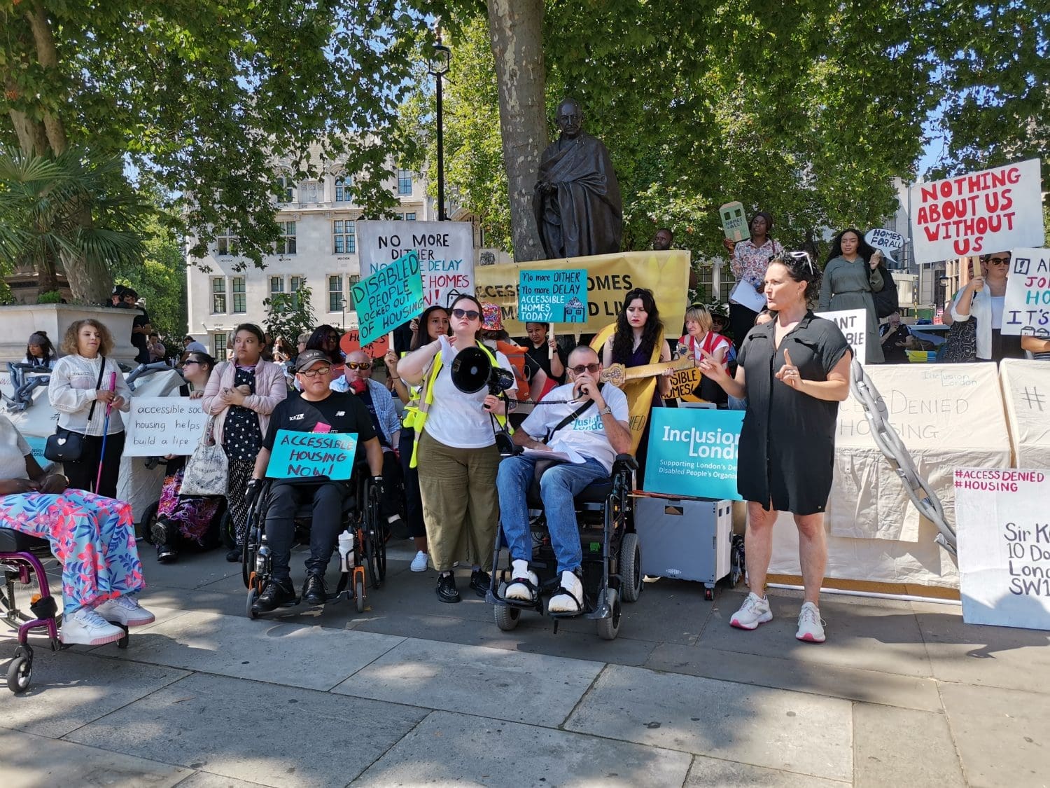 A group of disability rights campaigners stood protesting at parliament square 